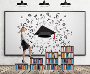 A woman in formal clothes is going up on the bookshelf. A concept of different level of education. A sketched graduation hat and different educational icons on the whiteboard.